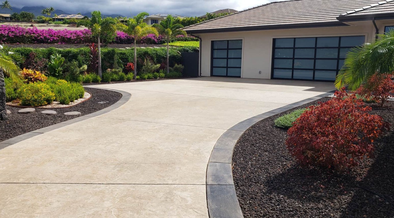 Beautiful curved concrete driveway with decorative borders in Lompoc residential property