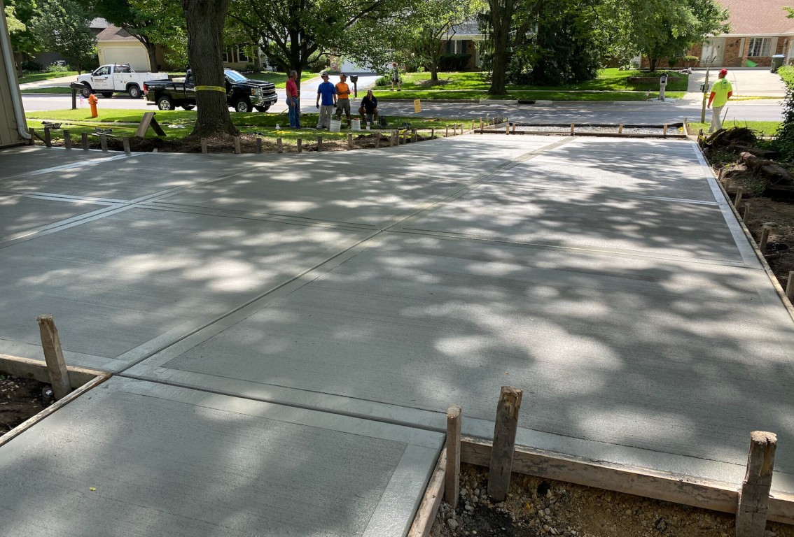 Professional concrete crew installing smooth residential driveway in Lompoc, CA