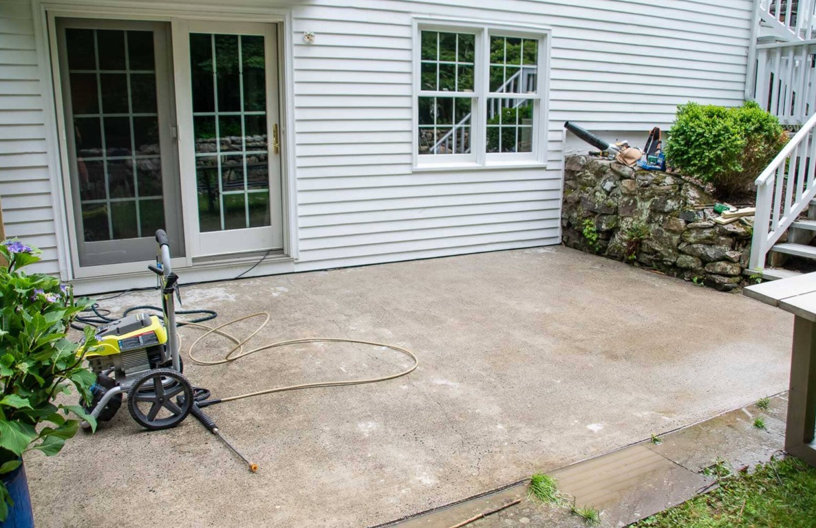 Clean concrete patio with pressure washer showing easy maintenance in Lompoc home
